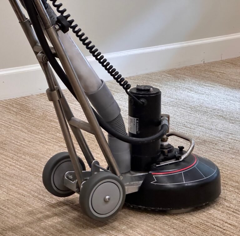 Low-moisture carpet cleaning machine on a home carpet