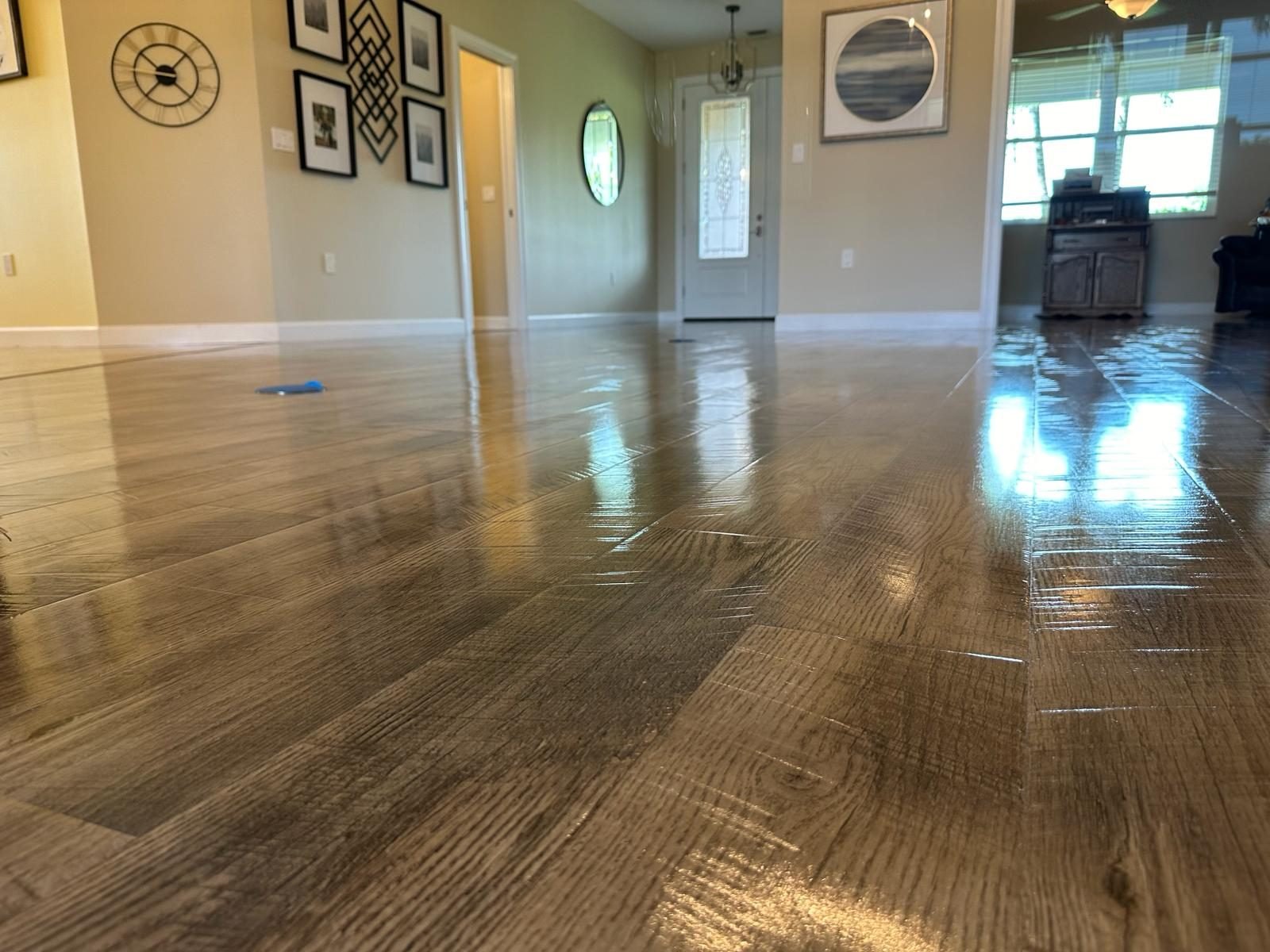 Luxury vinyl plank floor restored to high shine after professional Oh Limpio cleaning in Bradenton FL
