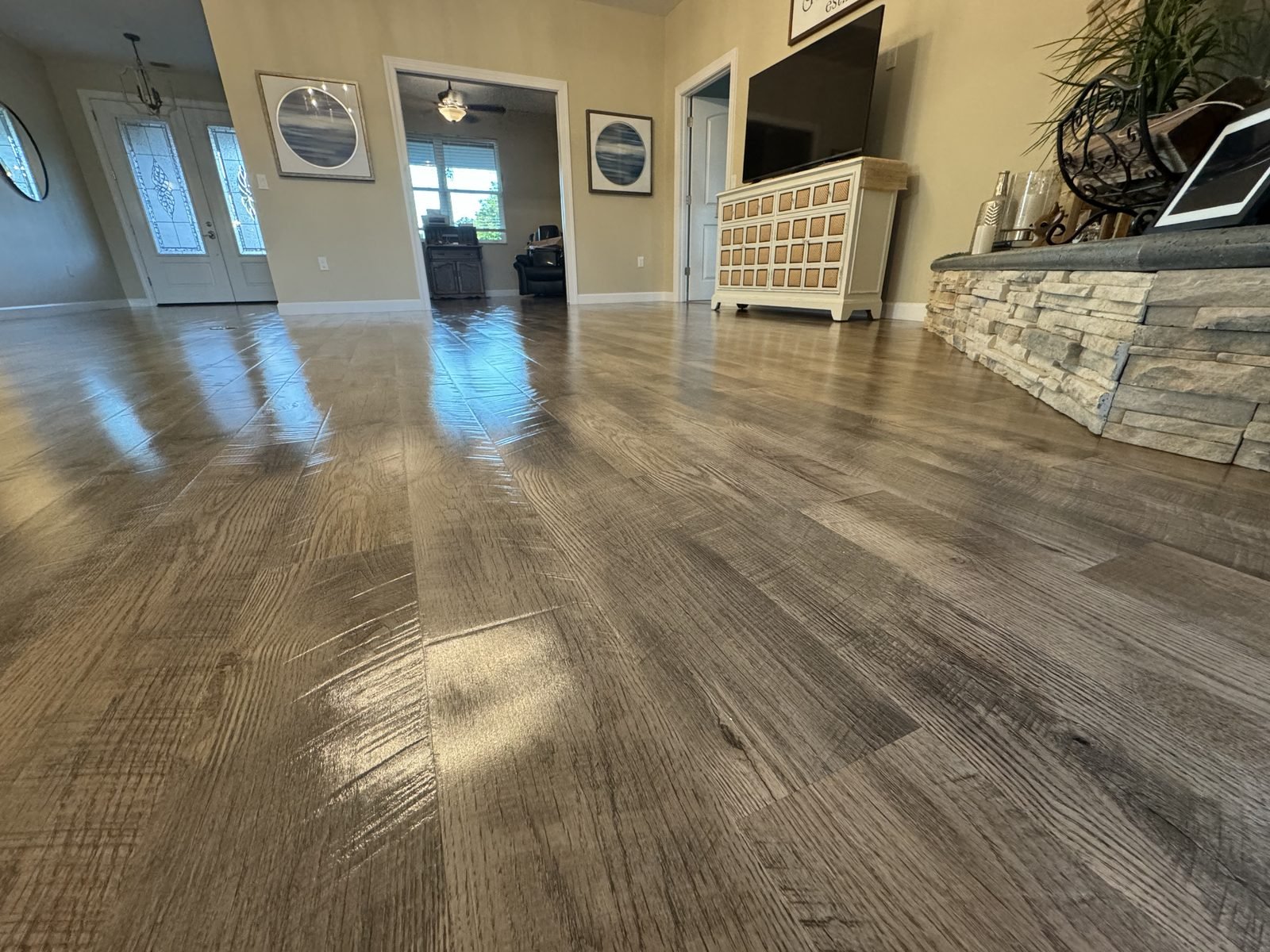 Close up of luxury vinyl plank floor after Oh Limpio cleaning and penetrating sealant application showing restored shine