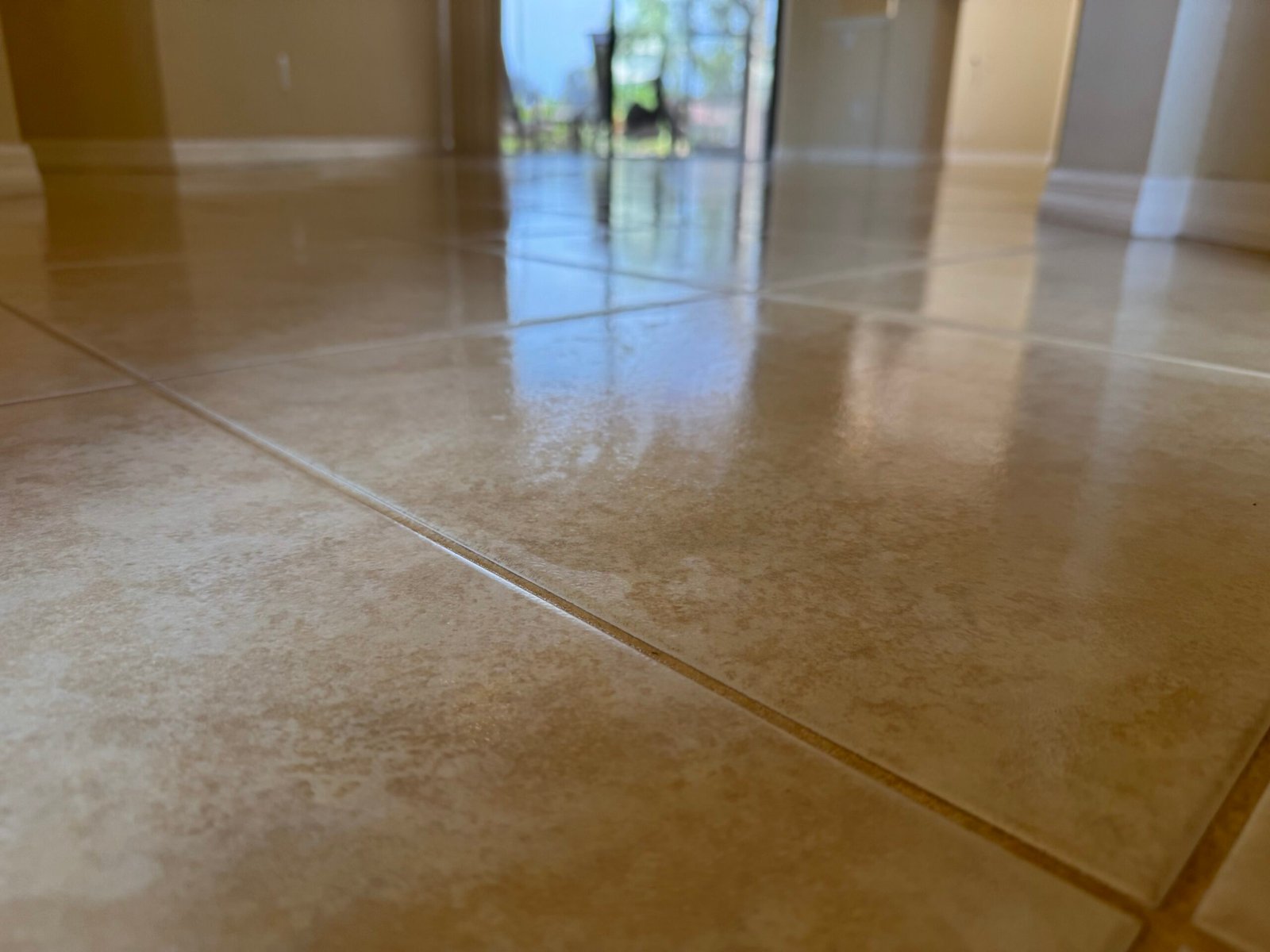 Residential tile and grout restoration before and after on a Bradenton kitchen floor