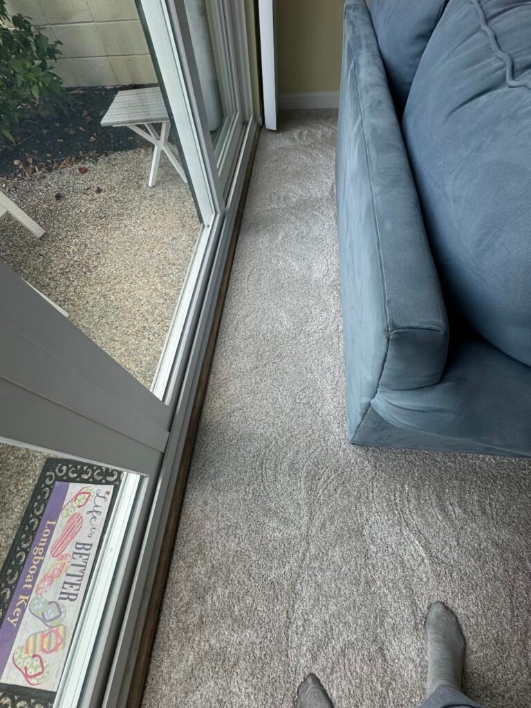 Carpet cleaned next to the lanai door of a Longboat Key condo