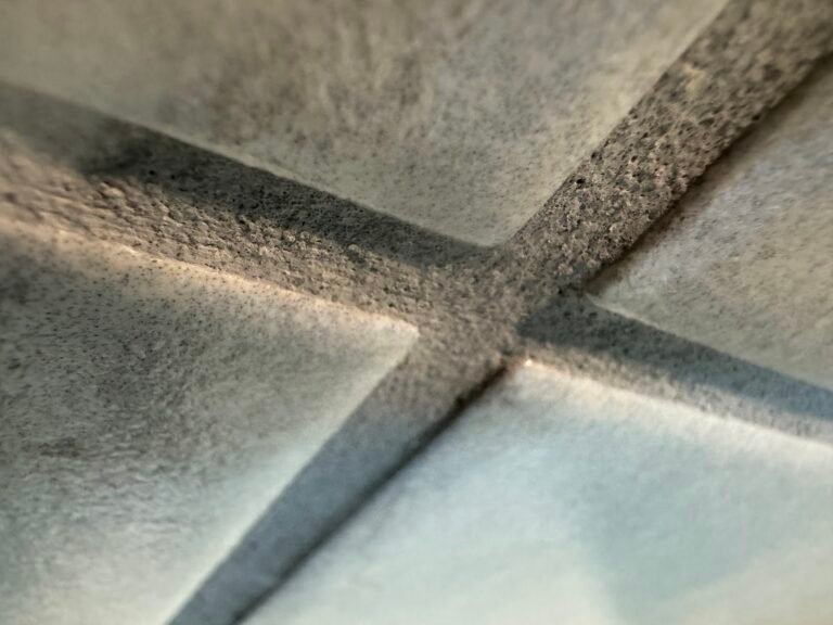 Close-up of sealed grout lines on shower wall tile